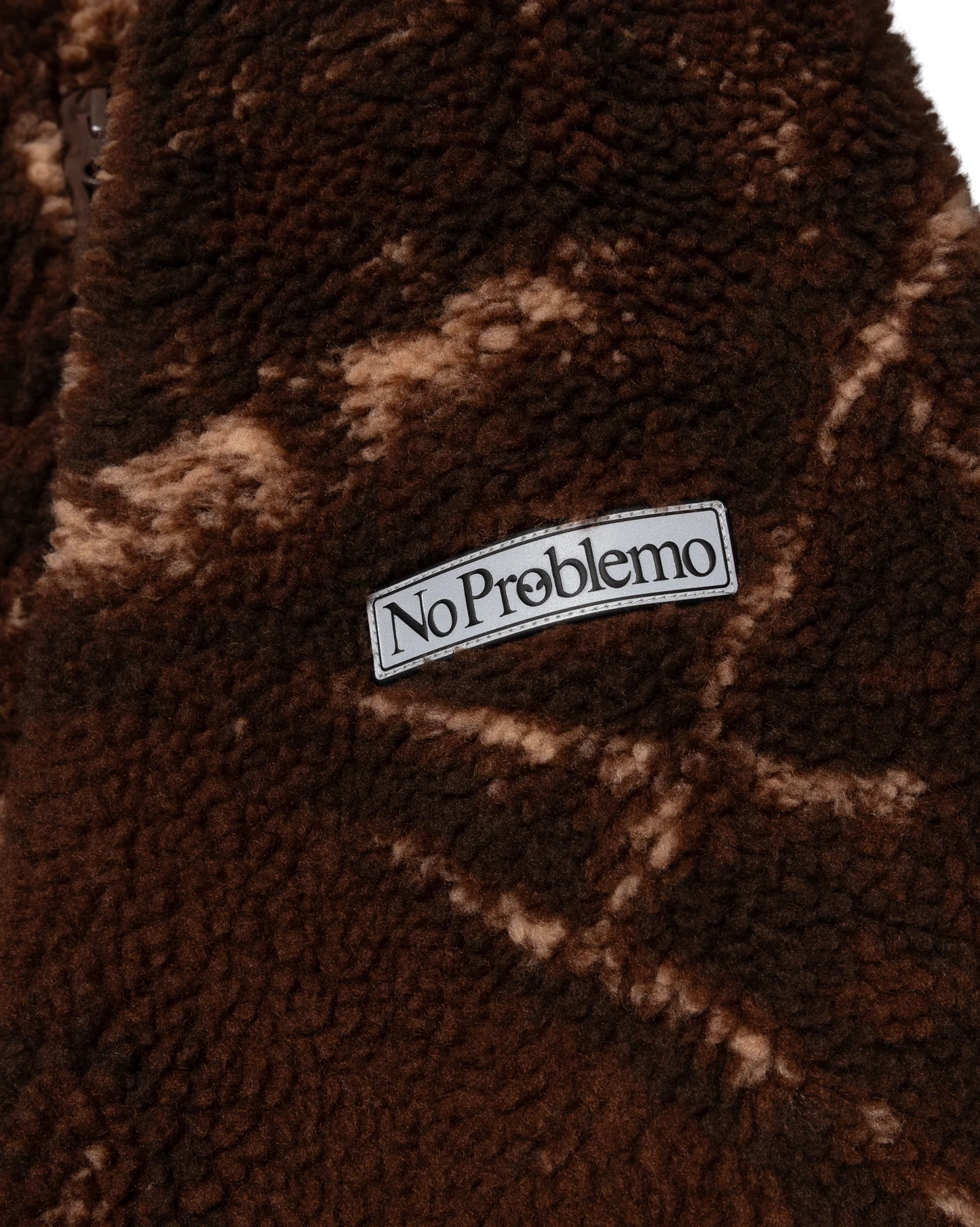 Brown textured fabric with 'No Problemo' label