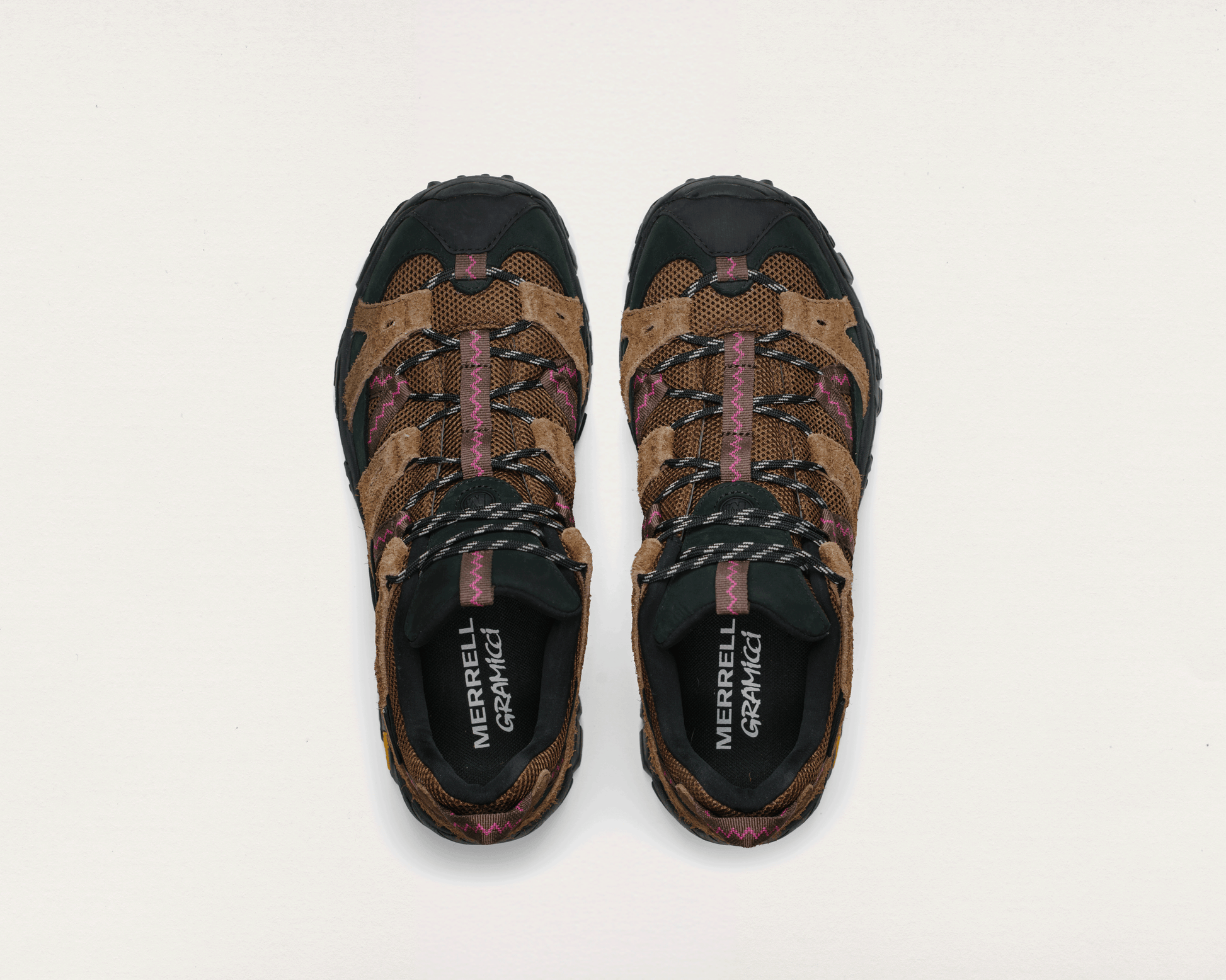 Pair of Merrell hiking shoes on a light gray background