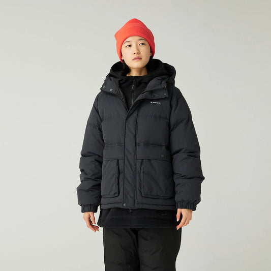 Person wearing a black jacket and red beanie on a light gray background